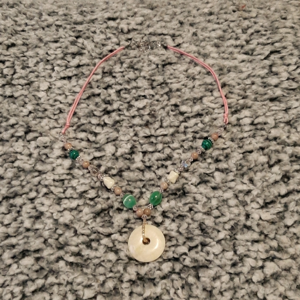Cream and green pendant necklace